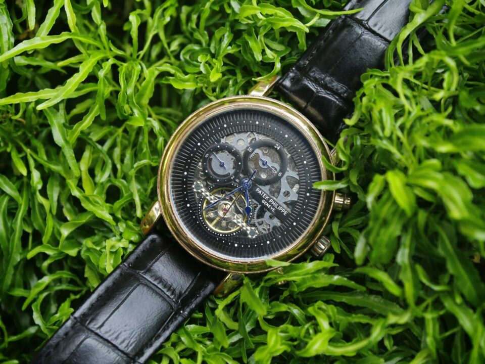 patek philippe geneve black watch with gold rim